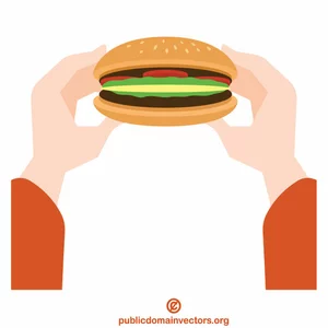 Hands hold a hamburger